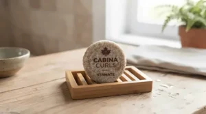 Zero-waste shampoo bar for curly hair on a bamboo soap dish.